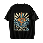 A black short-sleeve crewneck t-shirt featuring a vintage-style surf graphic on the front. The graphic depicts a vertical orange and blue surfboard surrounded by blue waves, with text reading 'WEST COAST CO' and 'RIDE THE WAVE SUMMER SESSION EST.