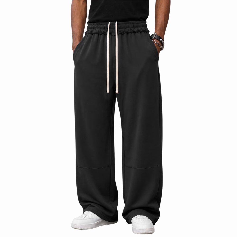 Men's baggy loose fit sweatpants with pockets featuring a relaxed style for gym, streetwear, and everyday comfort.