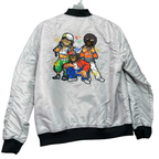 A silver satin bomber jacket shown from the back, featuring a colorful graphic print of four cartoon-style hip-hop characters on the center back. The jacket has black ribbed collar, cuffs, and hem, and is displayed on a hanger against a white background.