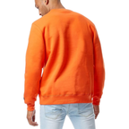 A man wearing a bright orange crewneck sweatshirt, viewed from the back, paired with light blue jeans against a plain white background.
