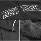 Black zip-up hoodie with white arched 'NEW YORK' lettering on the chest, shown in a three-panel detail layout highlighting the front graphic, sleeve trim, and plush fleece lining.