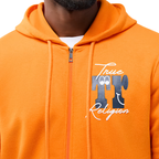 Close-up of a person wearing a bright orange zip-up hoodie with a front graphic that reads 'True TT Religion' in white and dark blue, over a white undershirt.